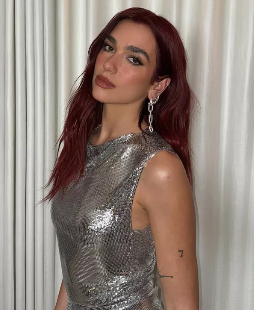 Dua Lipa Cherry Cola Red Hair Color Trend for Summer Season